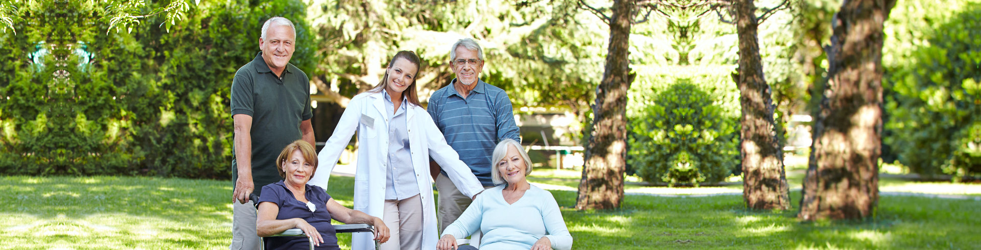 group of elderly people and caregiver