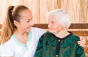 elderly woman with a caregiver